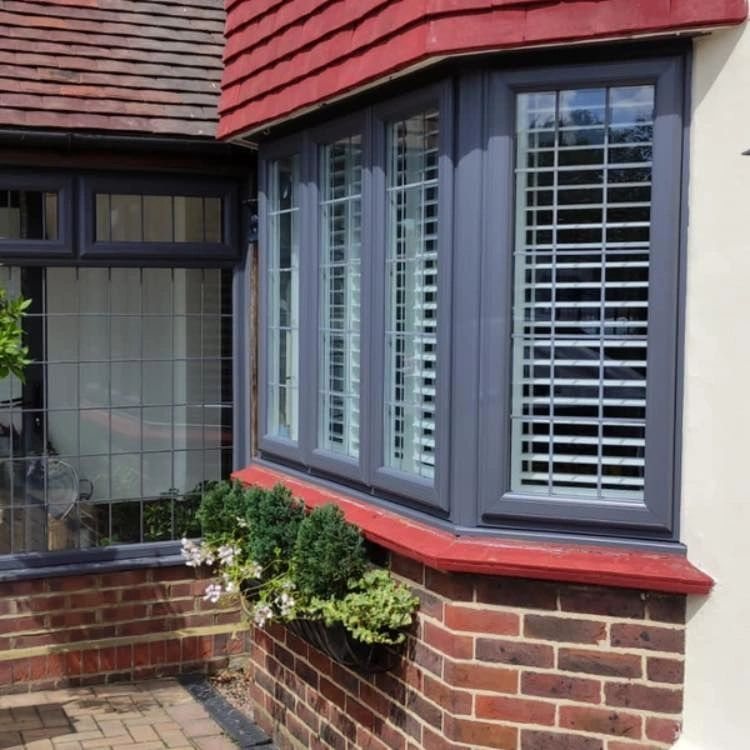 Bay window with dark sprayed frame finish