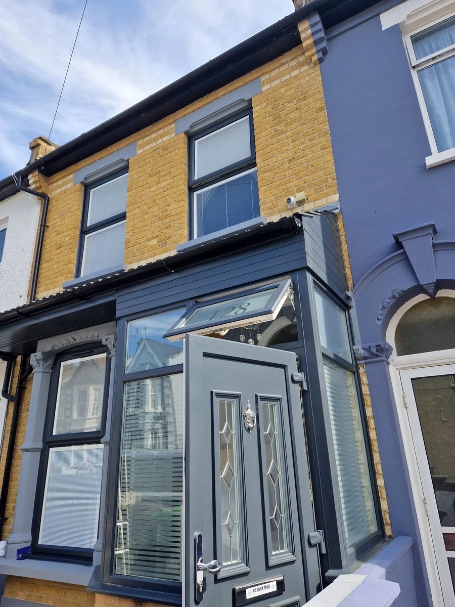 Exterior house painting with clean black trim