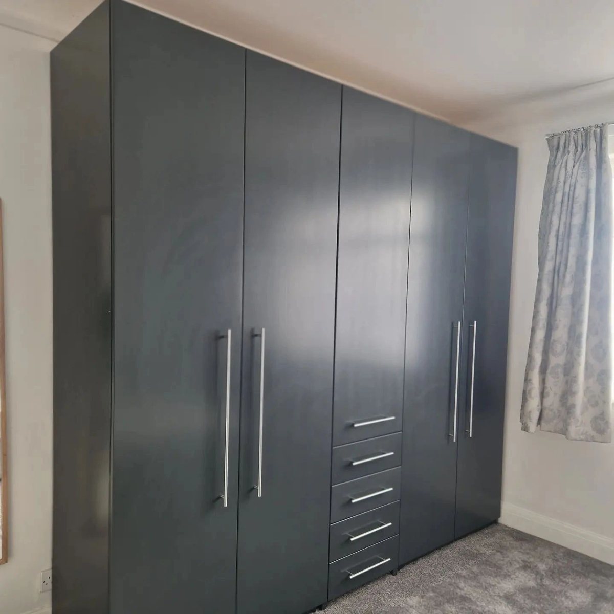 Dark fitted wardrobes after spraying