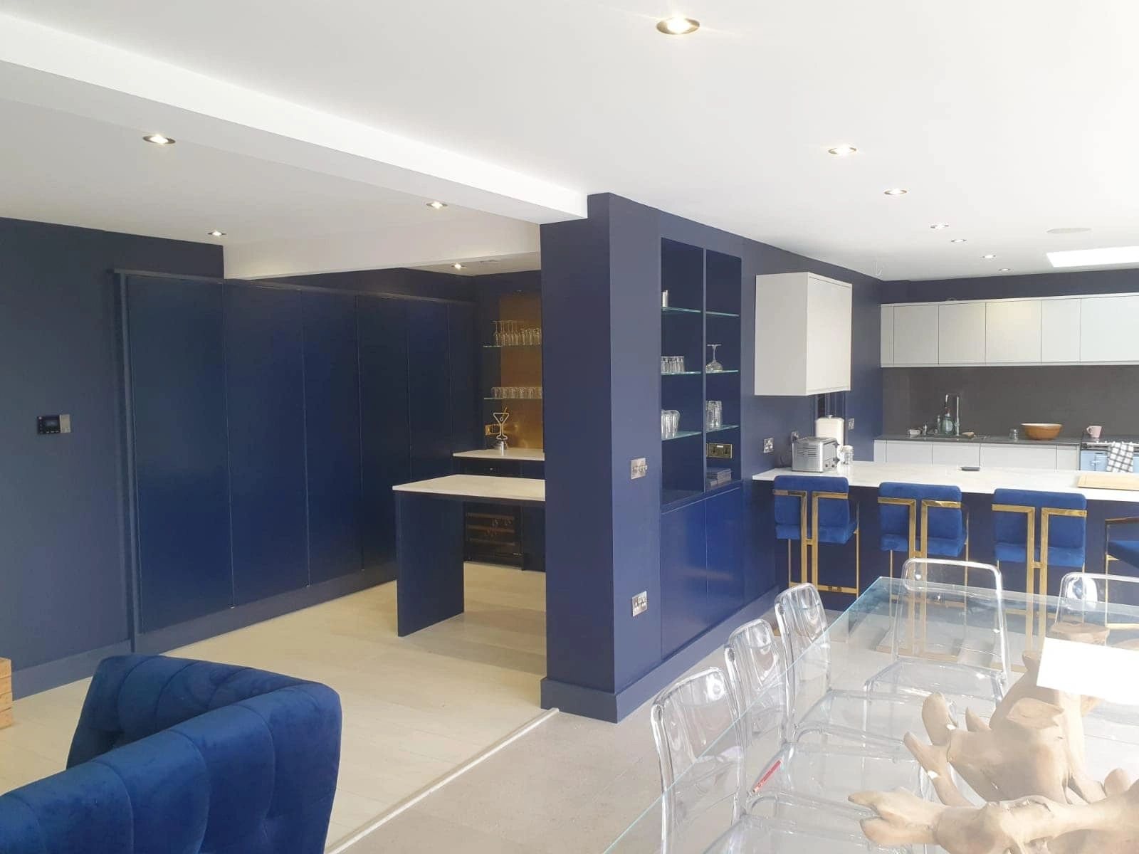 Large kitchen with blue sprayed cabinets