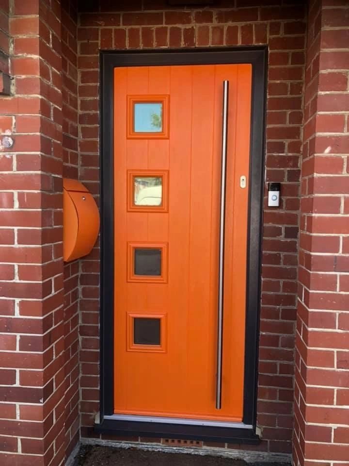 Orange front door after spraying